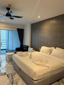 Ένα ή περισσότερα κρεβάτια σε δωμάτιο στο View Talay 6 Pattaya