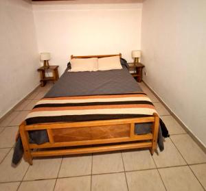 En eller flere senge i et værelse på Departamento De Los Rios