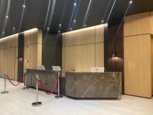 a conference room with a red rope in the middle at Mango Suites - Angeles in Angeles