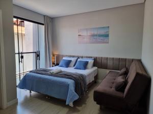 En eller flere senge i et værelse på Casa Duplex a 1km do Beto Carrero e 200m da praia