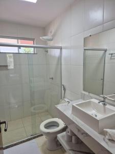 Et badeværelse på apartamento praia da perola ilheus + 20 billeder