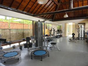 a gym with several treadmills and other exercise equipment at Nannai residence Flat 202 in Porto De Galinhas