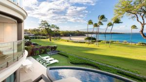 a view of the ocean from the balcony of a house at ❤PiH❤ Hapuna Beachfront Bliss Beachfront Steps From Ocean B29 in Hapuna Beach