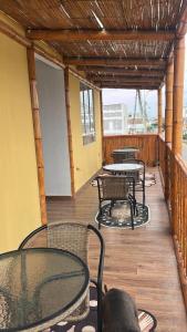 a patio with tables and chairs and tables and tablesearcher at Flamante atardecer in San Antonio