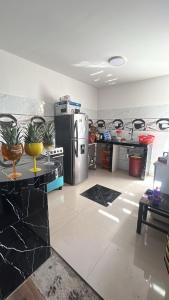 a kitchen with a refrigerator and a counter top at Flamante atardecer in San Antonio
