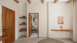 a bathroom with a mirror and a sink at Casa Amani 3BR Mediterranean w Pool Near Seminyak in Kerobokan