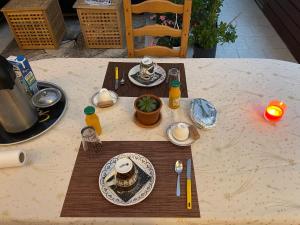 a table with a plate of food on it at Havre de paix in Maizières +5 photos