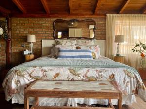 En eller flere senge i et værelse på One Cabañas Malva