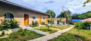 a house in a village with a yard at Koh Rong Lagoon in Koh Rong Island
