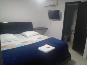 Giường trong phòng chung tại Hotel Plazuela Real