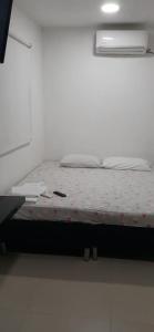 Giường trong phòng chung tại Hotel Plazuela Real