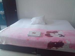 Giường trong phòng chung tại Hotel Plazuela Real