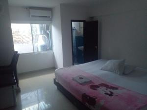 Giường trong phòng chung tại Hotel Plazuela Real