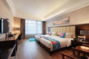 Postel nebo postele na pokoji v ubytování Fuzhou Xin Zi Yang Hotel + 248 fotografií
