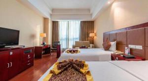 Postel nebo postele na pokoji v ubytování Qingdao Chengyang Detai Hotel + 212 fotografií