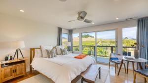 a bedroom with a bed and a large window at Coplan Vineyards by AvantStay 10-Acre Estate w Pool Spa Bocce Designer Interiors in Sonoma +52 photos
