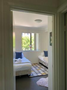 a room with two beds and a window at Platform One Guildford in Guildford