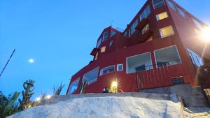 a red building with snow in front of it at La Vista in Guanajuato