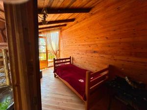 En eller flere senge i et værelse på Mountain Garden Cottage