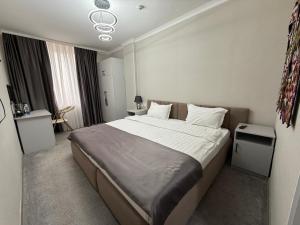 Ένα ή περισσότερα κρεβάτια σε δωμάτιο στο Taj Mahal Osh +16 φωτογραφίες