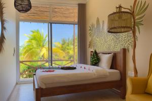 En eller flere senge i et værelse på The One Resort Zanzibar + 55 billeder
