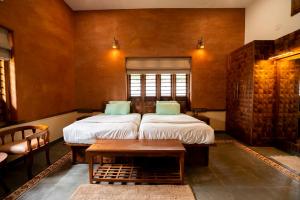 Postel nebo postele na pokoji v ubytování Paithrukam house luxurious earthy homestay