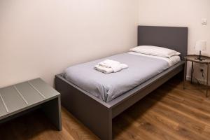 Ένα ή περισσότερα κρεβάτια σε δωμάτιο στο Ca' Martha - A due passi dal centro con parcheggio privato +10 φωτογραφίες