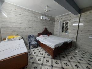 Ένα ή περισσότερα κρεβάτια σε δωμάτιο στο Emerald Mansion