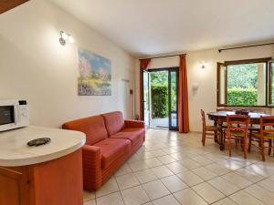 a living room with a couch and a table at Gorgeous Holiday Home in Sorano with Swimming Pool in Sorano