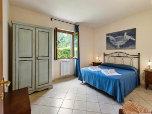 a bedroom with a bed and a window at Gorgeous Holiday Home in Sorano with Swimming Pool in Sorano
