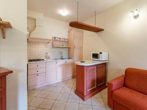 a small kitchen with a counter and a microwave at Gorgeous Holiday Home in Sorano with Swimming Pool in Sorano