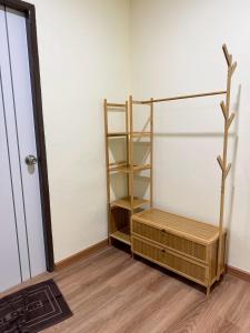 a room with a book shelf and a door at 79Hotel Rayong in Ban Hua Phrong