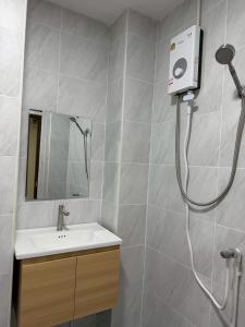 a bathroom with a shower and a sink at 79Hotel Rayong in Ban Hua Phrong +2 photos