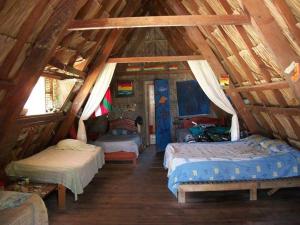 Postel nebo postele na pokoji v ubytování Ecohotel Arte y Aventura