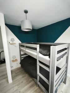 En eller flere senge i et værelse på le cosy proche du port