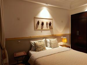 Ένα ή περισσότερα κρεβάτια σε δωμάτιο στο Appartement de Charme Avec Vue Sur Mer