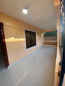 a living room with a window and a white floor at La Ureña House in La Ureña +1 photo