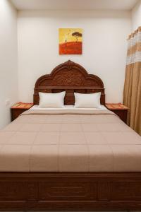 En eller flere senge i et værelse på Darshan home Prime Connected Location