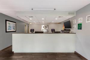 a lobby with a large white counter in a room at Quality Inn & Suites Easley - Greenville in Easley