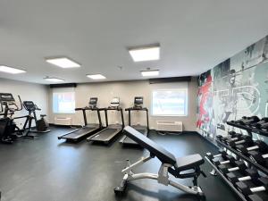 a gym with a row of exercise bikes and treadmills at Hawthorn Extended Stay by Wyndham Jackson in Jackson +11 photos