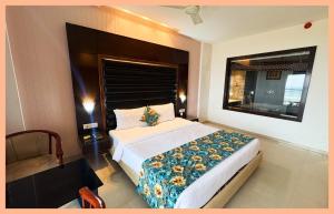 En eller flere senge i et værelse på Glory Crown In Bettiah