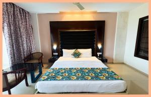 En eller flere senge i et værelse på Glory Crown In Bettiah