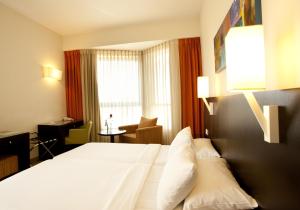 Voodi või voodid majutusasutuse Ein Kerem Hotel toas