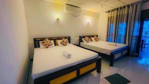 Postel nebo postele na pokoji v ubytování Can win Resort Yala