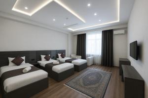 Postel nebo postele na pokoji v ubytování Vatan Hotel + 4 fotografie