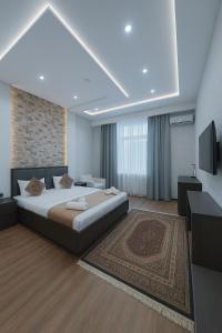 Ένα ή περισσότερα κρεβάτια σε δωμάτιο στο Vatan Hotel