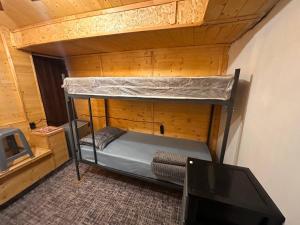 a bunk bed in a room with a tv at Tehran mets armenia in Yerevan