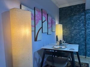 a dining room with a table and a chair at Stylish Modern Elegance Deluxe Suite in Lagos