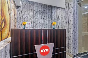 a novo booth with flowers on top of it at OYO 93463 Alwal Residency in Hyderabad