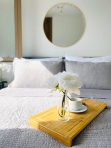 Giường trong phòng chung tại Sunny Bella Vista apartments +7 ảnh